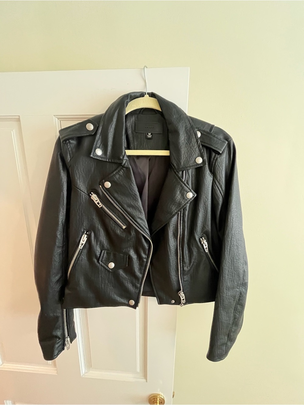 BlankNYC black stretch faux leather moto jacket. Size Medium